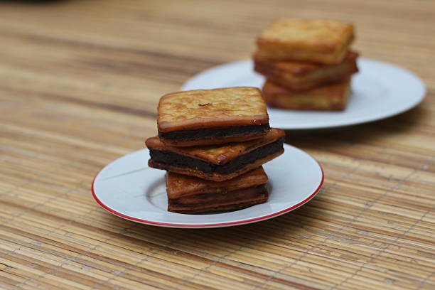 istock Delicious Chocolate Filled Crackers on a Wooden Table 2220825670