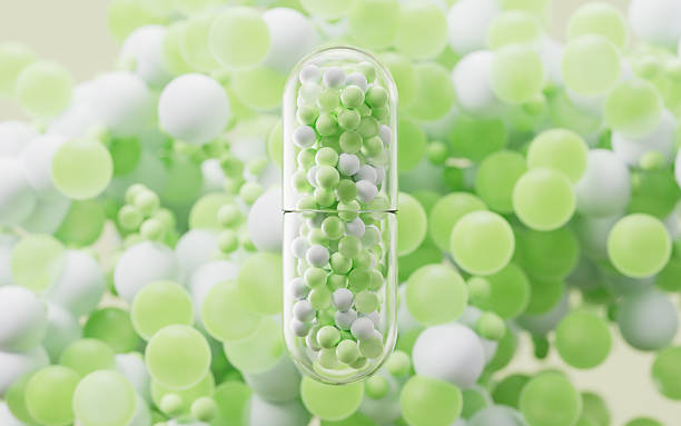 istock Transparent capsule with particles spheres background, 3d rendering. 2220827854