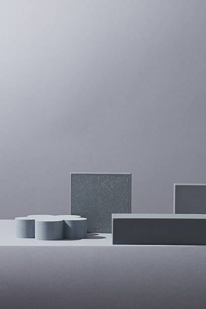 istock Assorted grey matte podiums in various heights and shapes on a soft gradient grey background. Suitable for skincare, beauty, or luxury product scenes. 2220828153