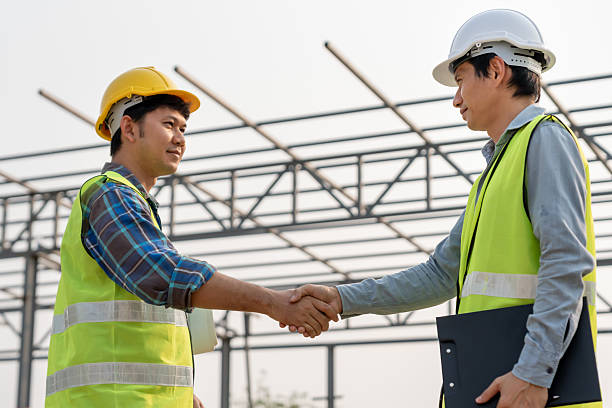 istock Construction team hands shaking greeting start up plan new project contract in office center at construction site, industry ,architecture, partner, teamwork, agreement, property, contacts. 2220833746
