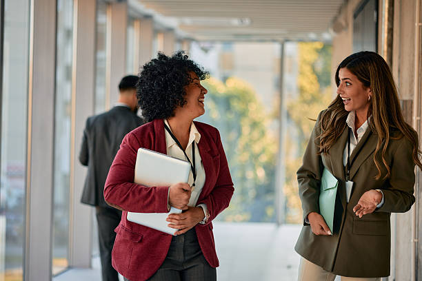 istock Two businesswomen chatting during a work break 2220840086