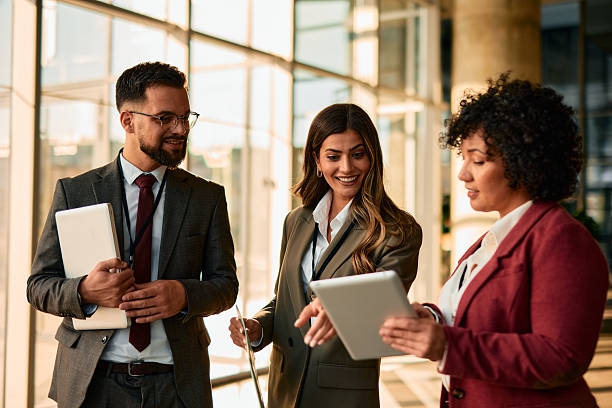 istock Businesspeople using digital tablet and discussing during a meeting 2220840147