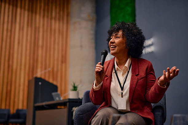 istock Motivational speaker inspiring audience at business conference 2220840559