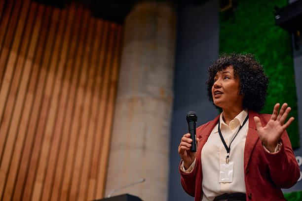 istock Motivational speaker inspiring audience at business conference 2220840585