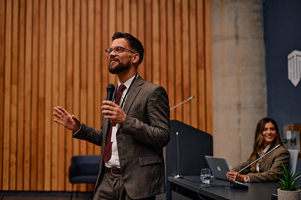 istock Motivational speaker inspiring audience during a business conference 2220840622