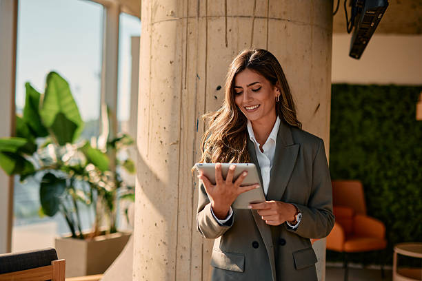 istock Young businesswoman using digital tablet in modern office 2220840871