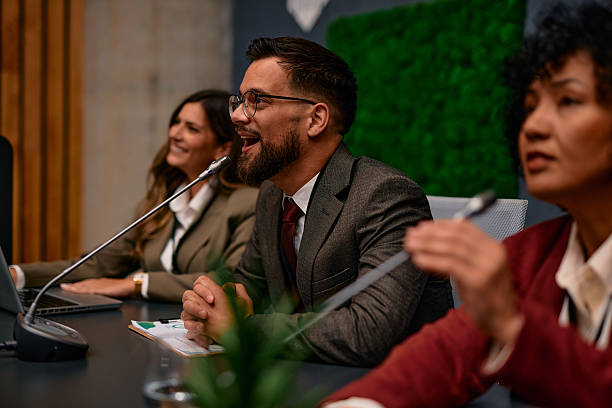 istock Businessman answering questions during a press conference 2220841183