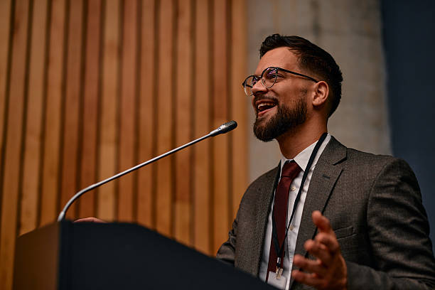 istock Motivational speaker inspiring audience with his speech at corporate seminar 2220841187