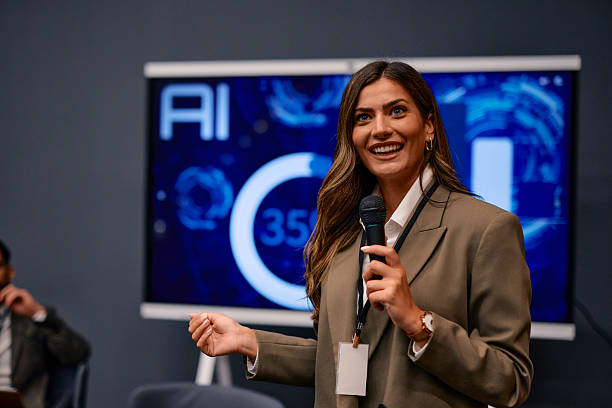istock Businesswoman presenting artificial intelligence smiling holding microphone 2220841260