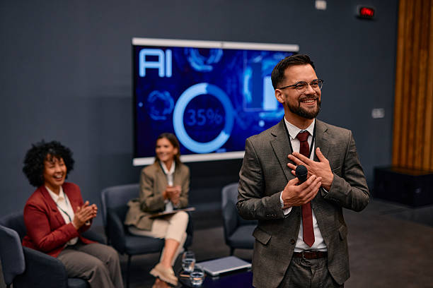 istock Smiling businessman giving a speech at a corporate event about artificial intelligence 2220841309