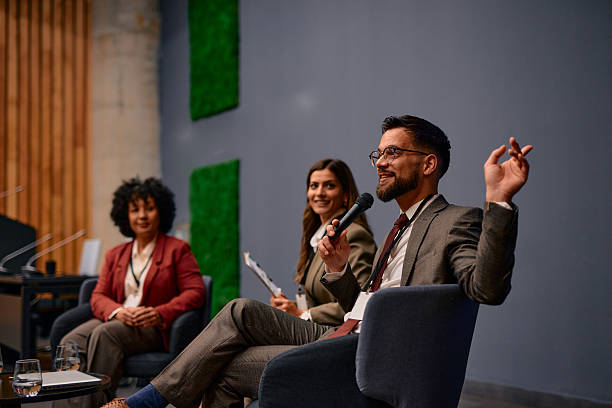 istock Motivational speaker talking to audience at business conference 2220841409