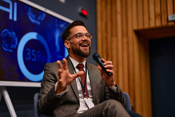 Motivational speaker inspiring audience with his speech during a business conference
