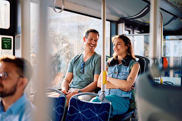 istock Young couple commuting together on a bus, enjoying their conversation 2220842548