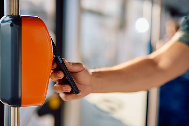 istock Passenger using smartphone to pay for public transport 2220842656