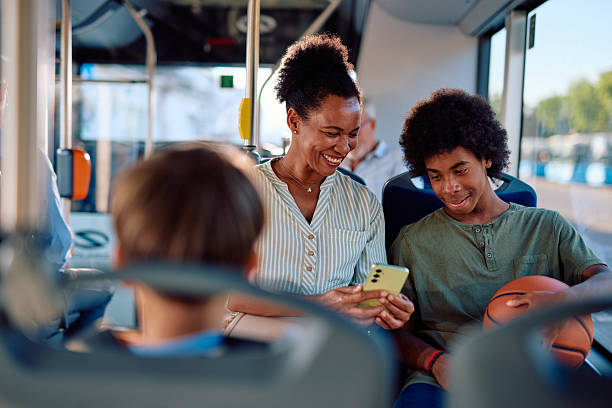istock Mother and son using smartphone on the bus 2220842745