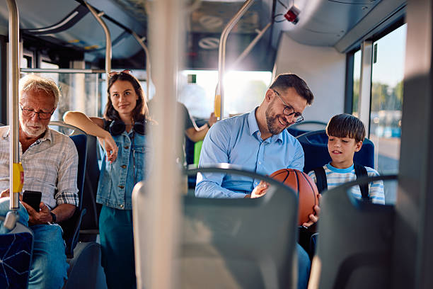 istock Father and son talking about basketball while traveling by bus 2220842856