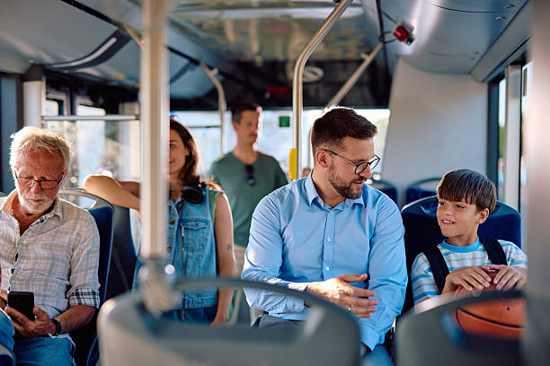 istock Father and son talking on the bus after school 2220842879