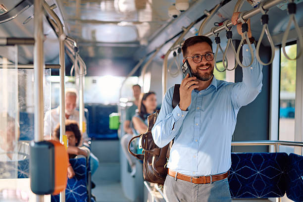 istock Young businessman talking on the phone while commuting by bus 2220842934