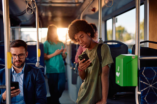 istock Passengers using smartphones while traveling by bus 2220843120
