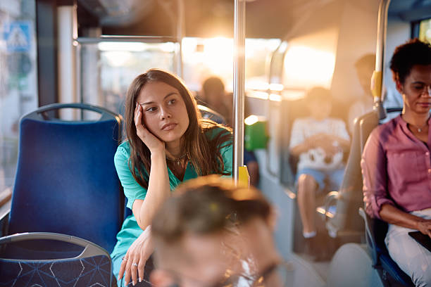 istock Young woman looking bored while sitting on a bus during her commute 2220843178