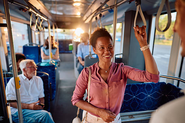 istock Young black woman commuting by bus and holding a handle 2220843591