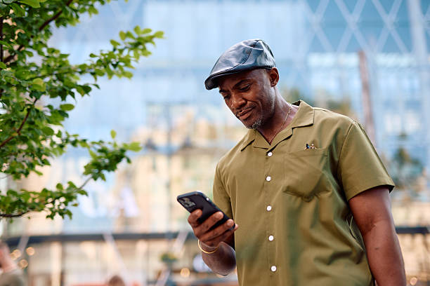 istock Stylish mature man using smartphone in urban setting 2220843964