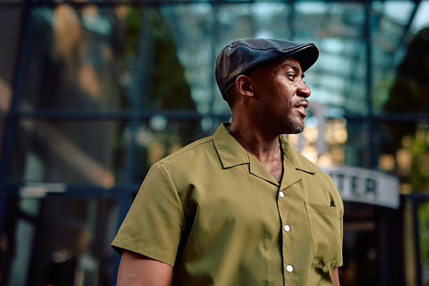 istock Stylish mature man looking away in urban setting 2220844345