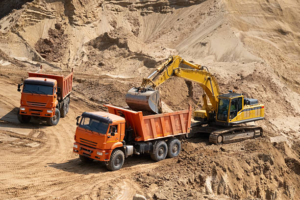 istock The process of loading sand in a sand quarry. Trucks are waiting for cargo. 2220846204