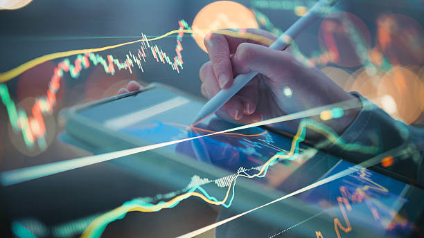 istock business hand analyzing color-coded financial report with revenue and expense breakdown on digital screen  economic performance sheet business financial metrics and forecast 2026 2220846436
