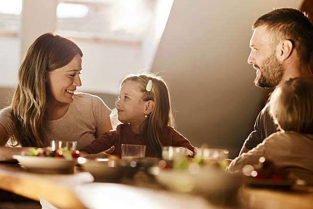 istock Young family talking during breakfast at dining table. 2220847004