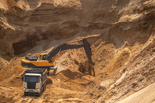istock The process of loading sand in a sand quarry. Trucks are waiting for cargo. 2220847097