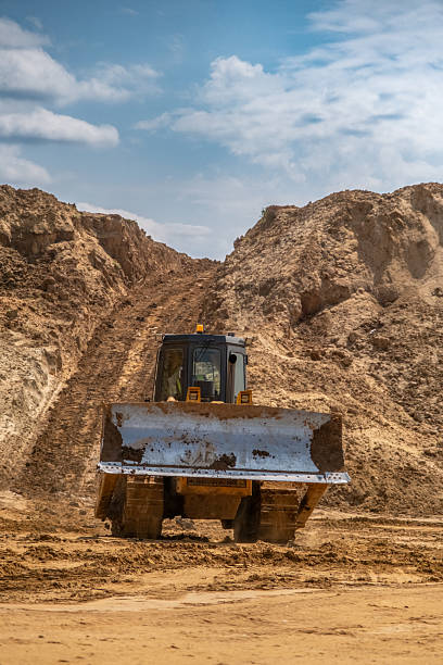 istock A crawler tractor with a bucket works in a sand quarry. 2220847598