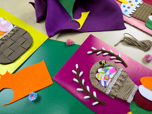 Process of creating colorful Easter cards using felt, yarn, and decorative accents
