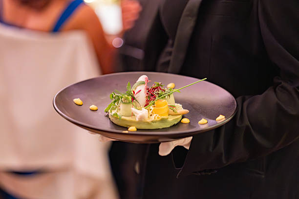 istock Elegant Appetizer Served by Gloved Waiter at Formal Dinner 2220859084