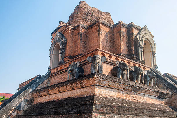 istock Ancient brick stupa of Wat Chedi Luang with steep staircase and elephant statues under clear blue sky in Chiang Mai, Thailand. Buddhist temple. Thai religious architecture. Travel landmark 2220863601