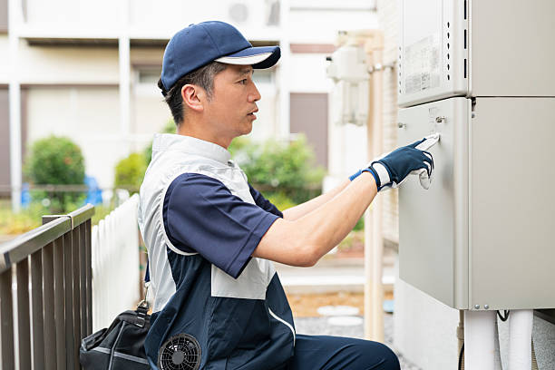 istock A male worker inspecting a water heater 2220864589