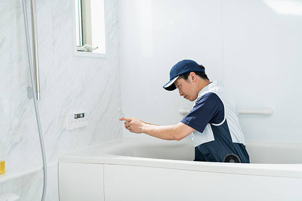 istock A male plumber checks the bathroom remote control 2220865619
