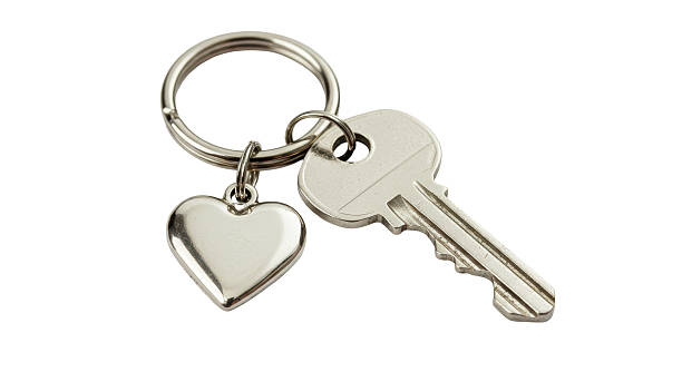 istock Isolated Key with Heart Shaped Keychain Silver 2220866031