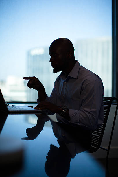 istock Businessman on a travel having a web conference from his Hotel room 2220873436