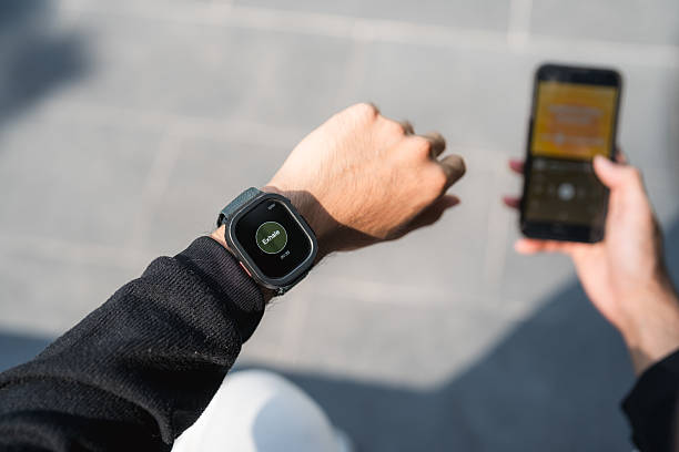 istock Young Man Using His Smartwatch to Guide Breathing and Meditation 2220874881