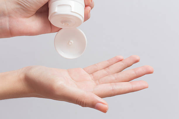 istock Woman pouring cream on hand 2220877007