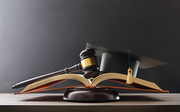 istock Concept of education judgment with book, mace and mortarboard 2220877766
