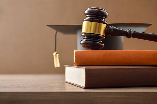 istock Educational trial with gavel on stack of books on table 2220877783