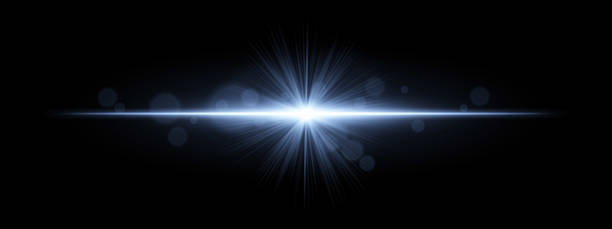 istock Light burst. Star-shaped flash with radial rays and soft bokeh on black background, ideal for magic, fantasy or romantic glow effects. 2220882781