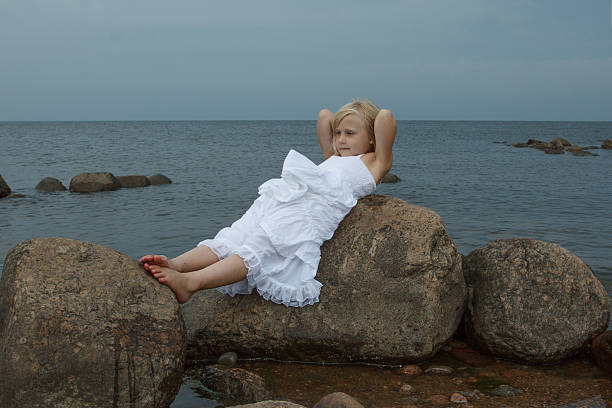 Resting little girl outdoors portrait.