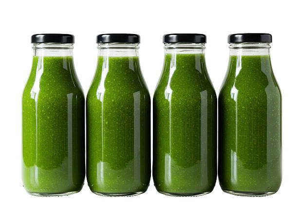 istock Isolated Row of Fresh Green Smoothie Bottles 2220886690