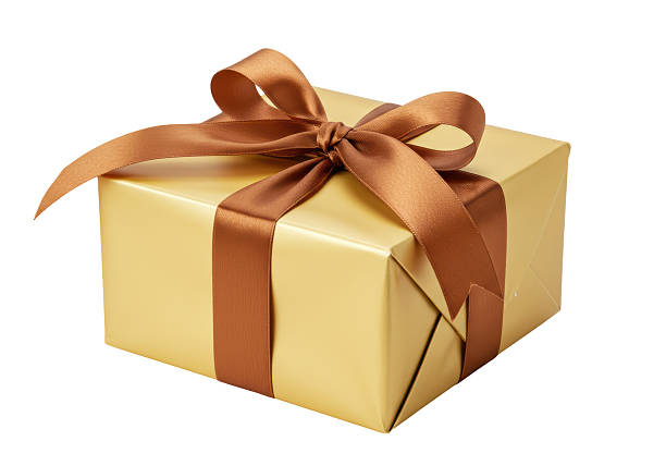 istock Isolated Gold Gift Wrapped with Brown Ribbon 2220886982