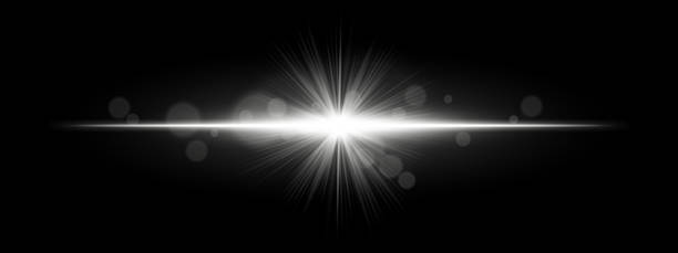 istock Light burst. Star-shaped flash with radial rays and soft bokeh on black background, ideal for magic, fantasy or romantic glow effects. 2220887232