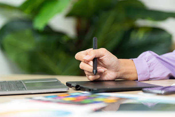 istock Graphic Design Creation. Designer sketching ideas on tablet with stylus. 2220890740