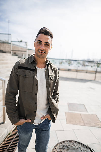 istock cheerful man standing in the street 2220892843